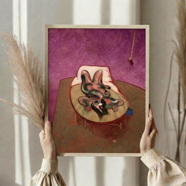Dark expressionist art print featuring an abstracted lying form rendered in ochre, gray, and black tones, displayed as a framed wall piece with a psychologically intense atmosphere.