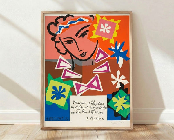 Framed modernist portrait of a woman with an elegant pompadour hairstyle, rendered in bold cutout shapes with warm ochres, soft pinks, and deep blues against a neutral background.