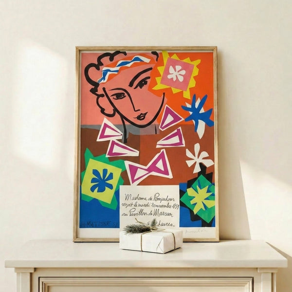 Wall-hung portrait artwork showing a confident woman with pompadour styling, rendered in the modernist cutout aesthetic with a harmonious palette of ocre, coral, navy, and cream.
