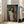 Retro poster displaying an avant-garde portrait with a luminous halo effect, rendered in the expressionist style with rich earth tones and atmospheric depth.
