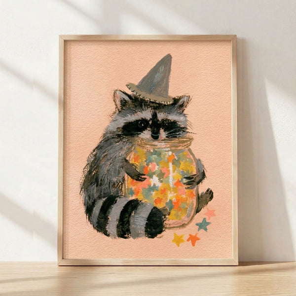 Watercolor and line art illustration of a whimsical raccoon wearing a pointed wizard hat, holding a jar filled with golden stars against a cream background.