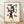 Abstract modernist poster featuring a stylized figure in black, red, blue, and yellow geometric forms suggesting a dynamic dancing or jumping pose, framed on a wall as a contemporary art print.