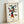 Vibrant modernist print with black outlines and red, blue, and yellow forms arranged in an abstract interpretation of movement and gesture, hung as a gallery-style wall art piece.