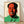 Bold pop art portrait of Mao in vibrant red, yellow, and pink tones with high-contrast graphic style, framed poster on wall.