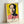 Framed modern portrait artwork featuring vivid magenta and yellow colorway on dark ground, exemplifying bold pop art aesthetic and subversive glamour.