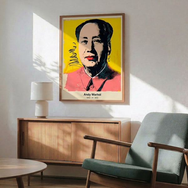 Pop art style portrait print with saturated bright colors including magenta, yellow, and cyan set against black, hung as modern statement wall art.