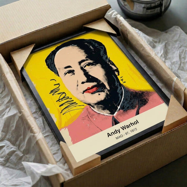 Iconic face portrait rendered in striking pop art style with bright magenta, yellow, and cyan tones, displayed as framed modern print with subversive edge.