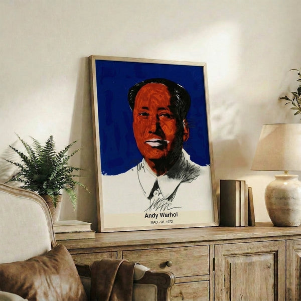 Framed modern art print featuring a striking face rendered in neon green, hot pink, and orange using bold pop art techniques with a distinctly iconic flair.