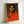Colorful silkscreen-style portrait print with a striking palette and minimalist geometric approach to facial features.