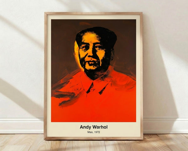 Bold pop art portrait with stylized face in vibrant red, yellow, and green tones on black background, iconic 1970s modern art print framed on wall.