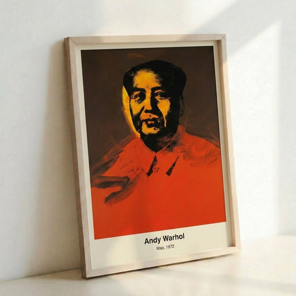 Vibrant pop art print with geometric portrait in red, yellow, and green hues set against dark background, modern framed artwork.