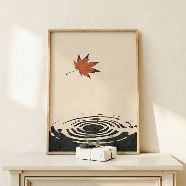 Japanese-influenced abstract poster depicting a solitary maple leaf within radiating water ripples and an enso symbol, rendered in restrained black, rust, and charcoal tones on cream for contemplative wall display.