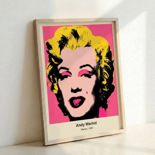 Striking pop art face portrait rendered in hot pink, gold, and black, capturing an iconic and provocative mood in modern gallery-style framed presentation.