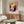 Modern pop art wall art showing a stylized woman's portrait in electric pink and gold against black and white elements, exuding iconic intensity.