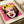 Trendy contemporary pop art print of a facial portrait in saturated pinks, blacks, and gold, evoking bold cultural commentary in framed form.