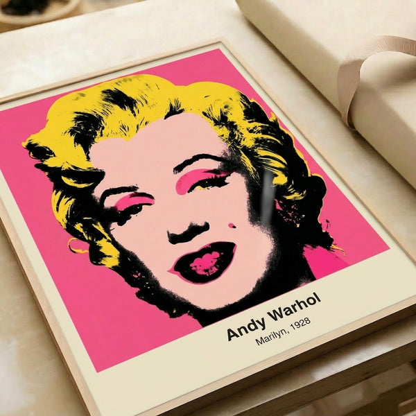 Trendy contemporary pop art print of a facial portrait in saturated pinks, blacks, and gold, evoking bold cultural commentary in framed form.