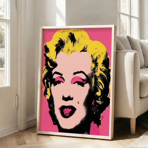 Vibrant pop art portrait with bold color blocking in warm and cool tones, presented as a framed contemporary art print on a wall.