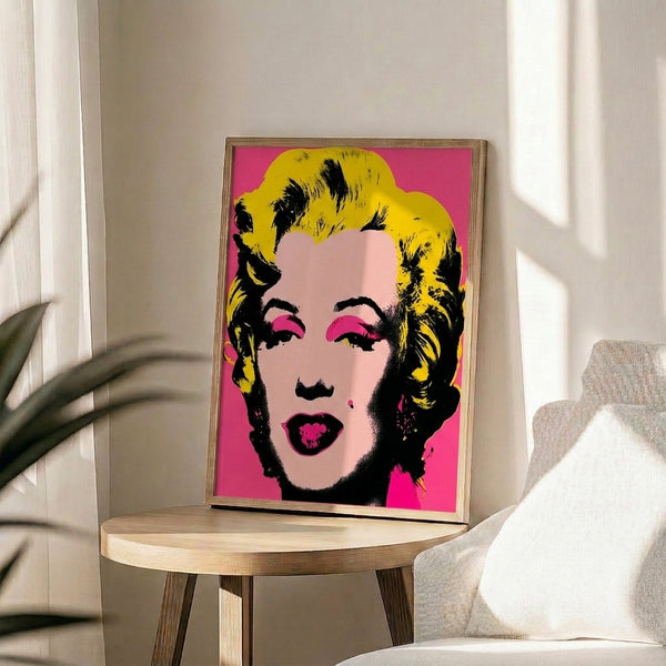 Iconic pop art style portrait with bold graphic elements and vivid neon color palette, hung as a framed poster artwork.