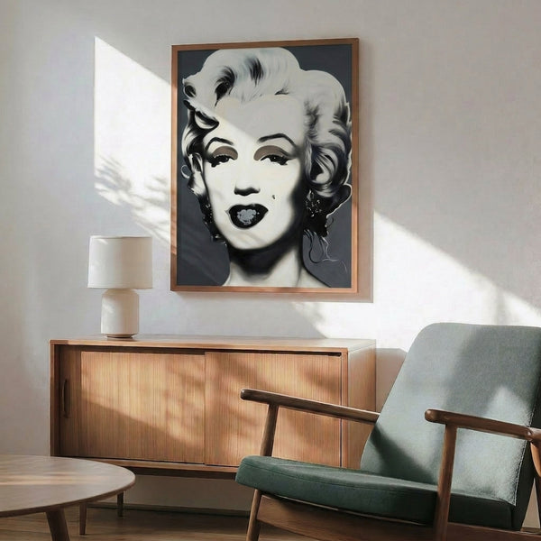 Pop art style portrait of Marilyn Monroe rendered in black and white with simplified features and bold graphic treatment as a framed print.