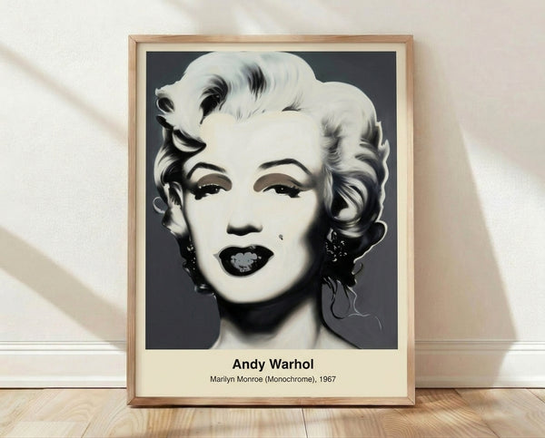Bold pop art portrait of Marilyn Monroe in monochrome black, white, and gray tones, featuring stylized facial features with iconic elegance, framed as a modern wall art print.