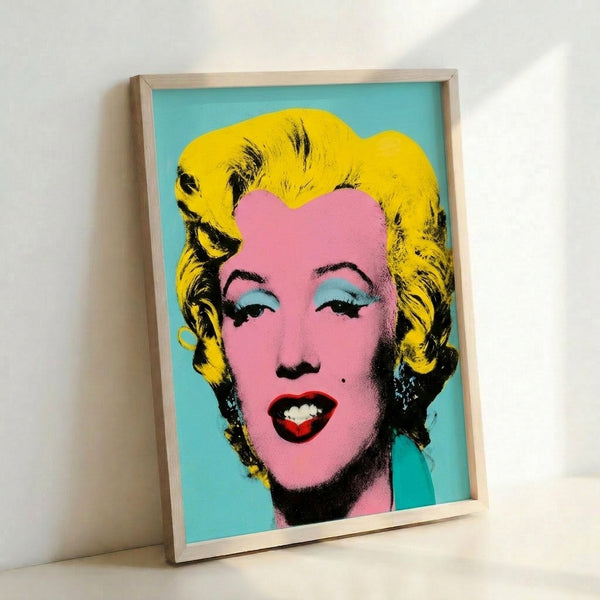 Contemporary pop art print of Marilyn Monroe rendered in cool blue palette with characteristic Warhol silkscreen technique.