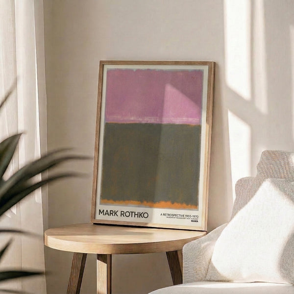Abstract modern poster with muted mauve pink and olive green color planes accented by burnt orange, framed and displayed in contemplative style.