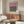 Minimalist abstract artwork in soft mauve, olive, and burnt orange tones creating a melancholic, meditative visual experience on neutral ground.