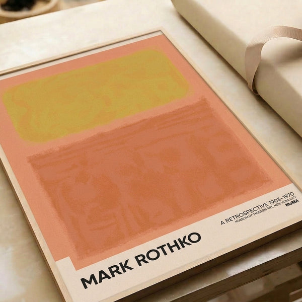 Minimalist framed artwork featuring warm palette of soft coral, gold, and beige in abstract rectangular composition for tranquil interior space.