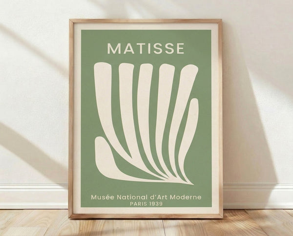 Matisse exhibition poster from 1939 featuring a minimalist hand and organic leaf forms in sage green and cream, embodying Bauhaus design principles and mid-century modern aesthetics.