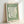 Abstract Matisse poster showcasing an elegant hand reaching among stylized plant leaves in soft sage green, a restrained mid-century modern masterpiece.