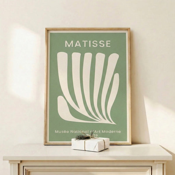 Bauhaus-style framed print depicting organic forms of a hand and foliage in cream and sage tones, evoking modernist elegance and botanical serenity.