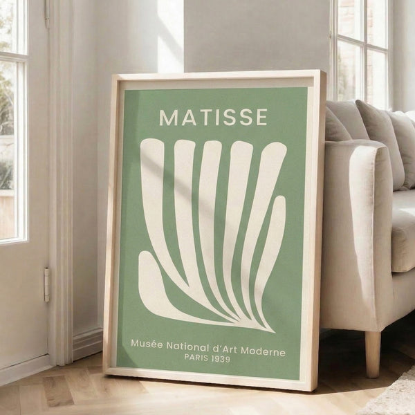 Matisse 1939 exhibition artwork displayed as a framed poster: minimalist hand and leaf motifs in soft sage and neutral hues, refined mid-century design.