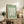 Sophisticated modernist composition featuring a delicate hand and organic plant forms rendered in sage green and cream, a serene Matisse-inspired wall art piece.