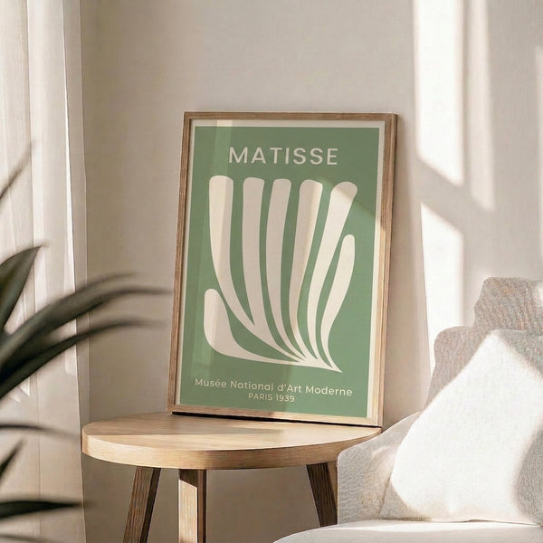 Framed Bauhaus poster with abstracted hand and botanical imagery in muted sage and off-white, capturing mid-century organic modernism and elegance.