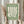 Matisse-style art print showing a graceful hand amid stylized leaves in soft sage green and cream, a minimalist poster celebrating modernist sophistication.