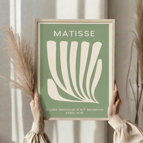 Matisse-style art print showing a graceful hand amid stylized leaves in soft sage green and cream, a minimalist poster celebrating modernist sophistication.