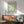 Bauhaus-influenced framed artwork featuring organic hand and plant forms in serene sage and neutral palette, evoking mid-century modern elegance.