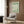 Abstract Matisse poster with simplified hand gesture and botanical elements in cream and sage tones, sophisticated modernist wall decoration.