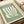 Matisse 1939 exhibition poster art: minimalist composition of hand and leaves in muted sage and cream hues, refined modernist wall piece.