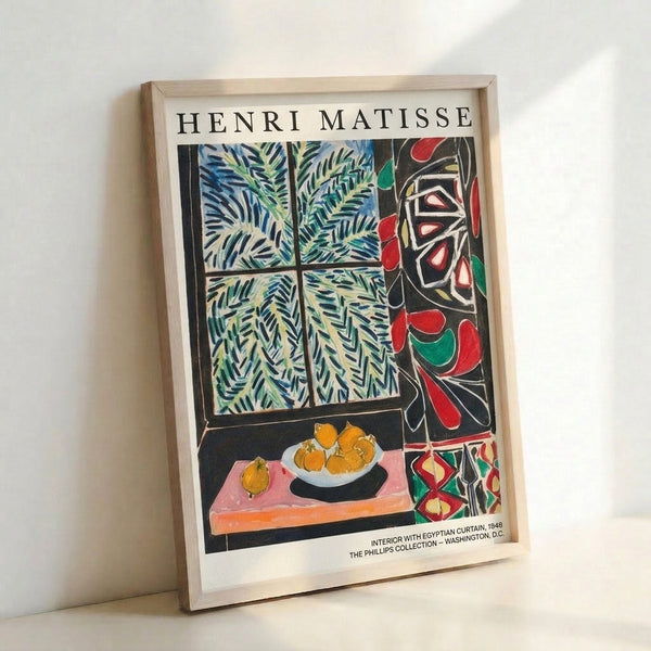 Framed poster of a sophisticated interior with draped Egyptian-patterned curtains, lush greenery, and a still life arrangement of lemons, rendered in elegant cream, blue, and black palette.