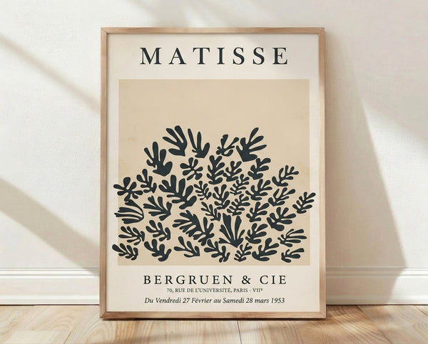 Matisse Bergruen Cutouts 1953 framed poster featuring organic leaf and coral shapes in cream and charcoal on a sophisticated mid-century wall.