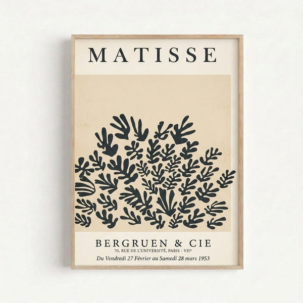 Framed art print of abstract botanical forms in black and beige inspired by Matisse's vintage cutout technique, serene and refined.