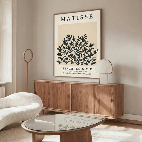 Framed Matisse-inspired cutout design featuring organic plant forms and leaves in cream and black, sophisticated vintage art print.