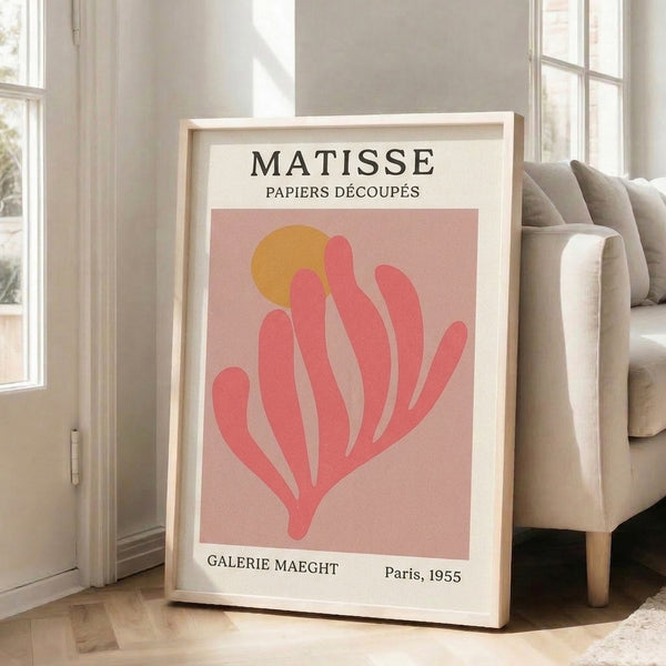 Framed poster of flowing abstract leaf form in dusty rose and warm gold tones, epitomizing sophisticated mid-century paper cut design.