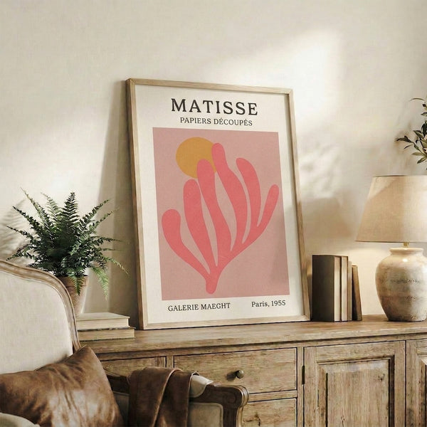 Minimalist plant-inspired wall print in blush pink and ochre, with organic curving shapes reflecting serene mid-century modern style.