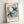 Sophisticated wall art displaying stylized bird silhouette and crescent moon in cream and charcoal tones, reflecting vintage papier découpé aesthetics.