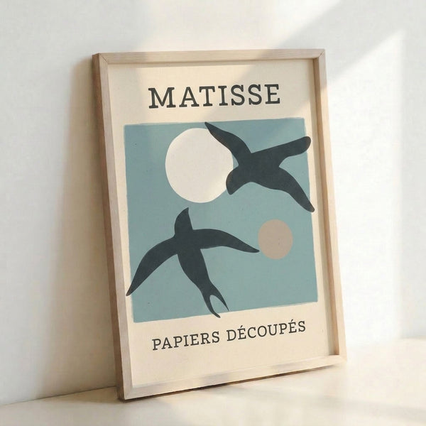 Sophisticated wall art displaying stylized bird silhouette and crescent moon in cream and charcoal tones, reflecting vintage papier découpé aesthetics.