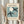 Elegant framed art print showcasing cut-out bird and crescent moon design in charcoal, cream, and subtle blue hues with refined artistic restraint.