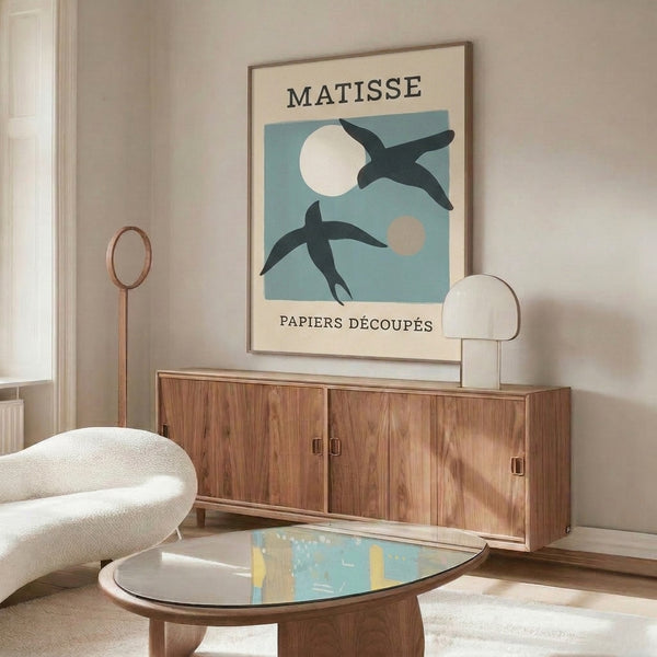 Serene and playful abstract poster featuring stylized bird with moon in soft whites, blues, and blacks, celebrating timeless minimalist design.
