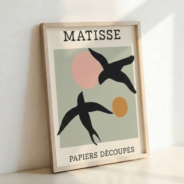 Bauhaus-inspired framed print of stylized birds composed from overlapping circles and organic shapes in sage green, cream, ochre, and blush, embodying minimalist elegance.